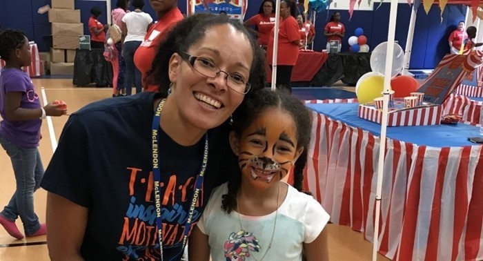 Teacher and student with their face painted